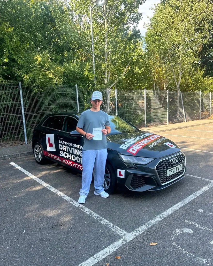 First-time pass photo with the school car
