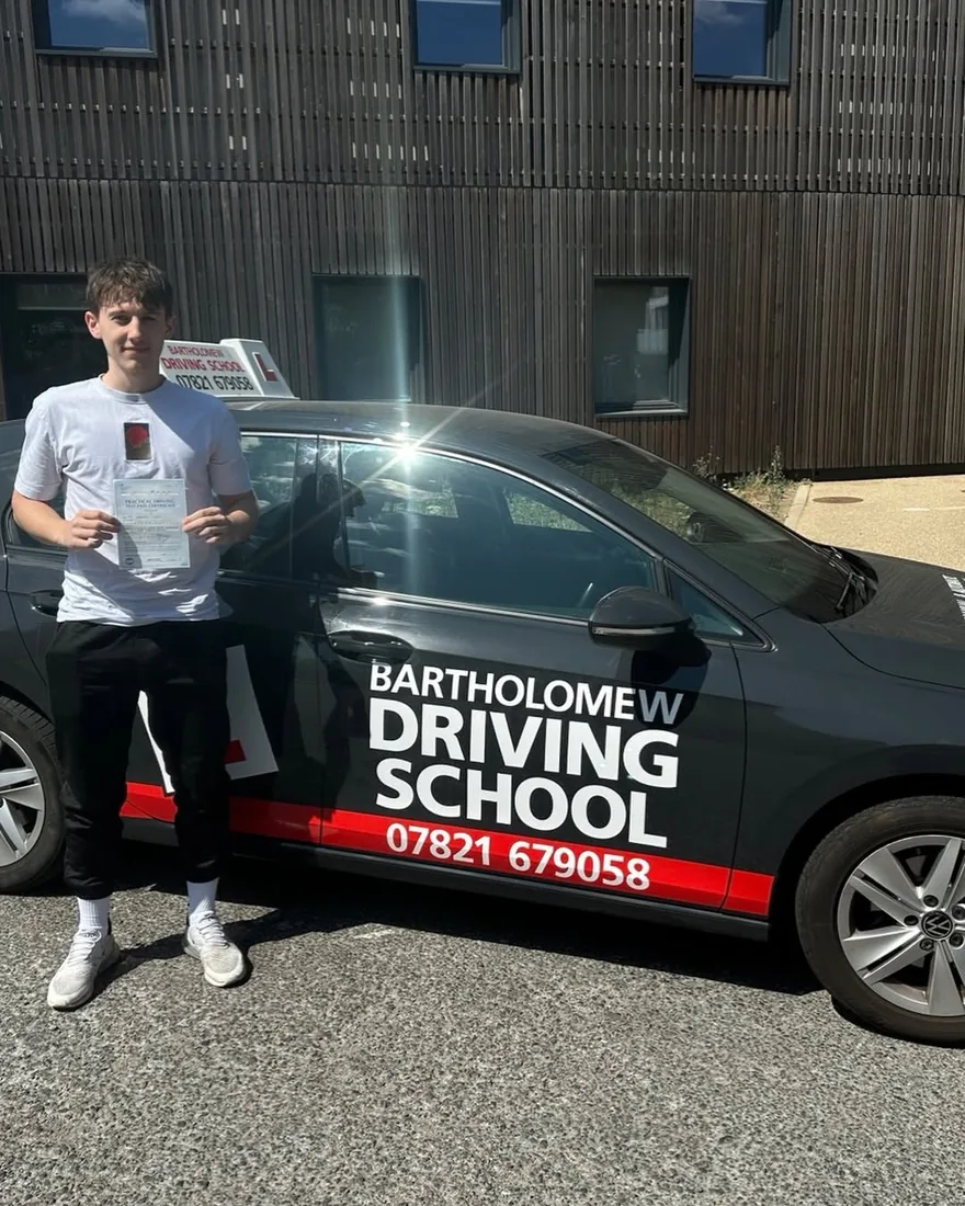 First-time pass photo with the school car