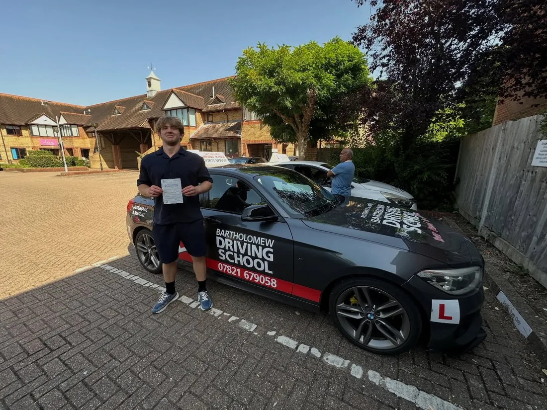First-time pass photo with the school car