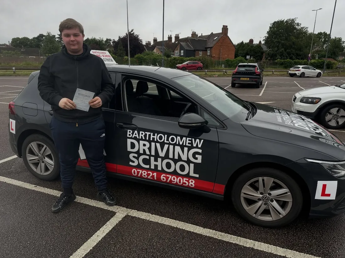 First-time pass photo with the school car
