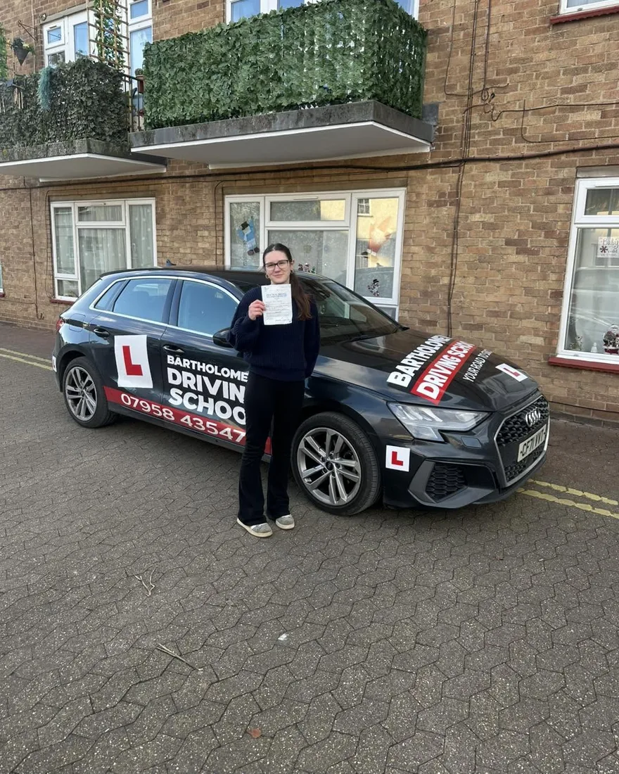 First-time pass photo with the school car