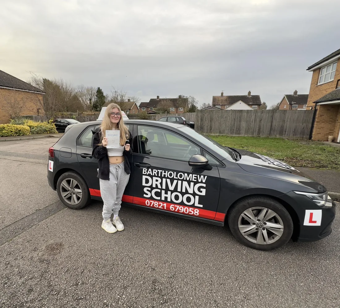 First-time pass photo with the school car