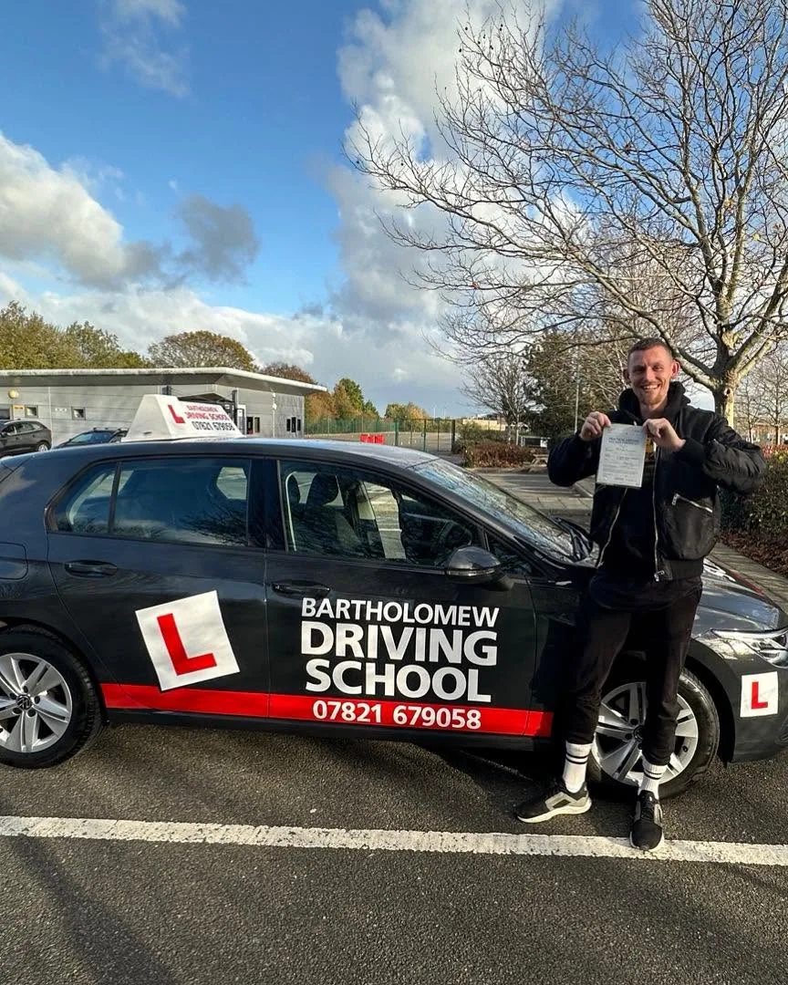 First-time pass photo with the school car