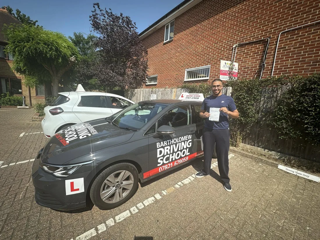 First-time pass photo with the school car