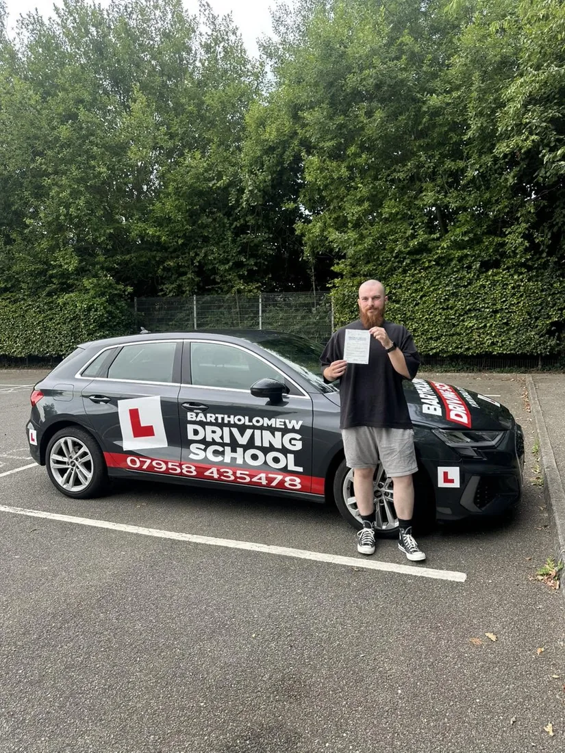 First-time pass photo with the school car