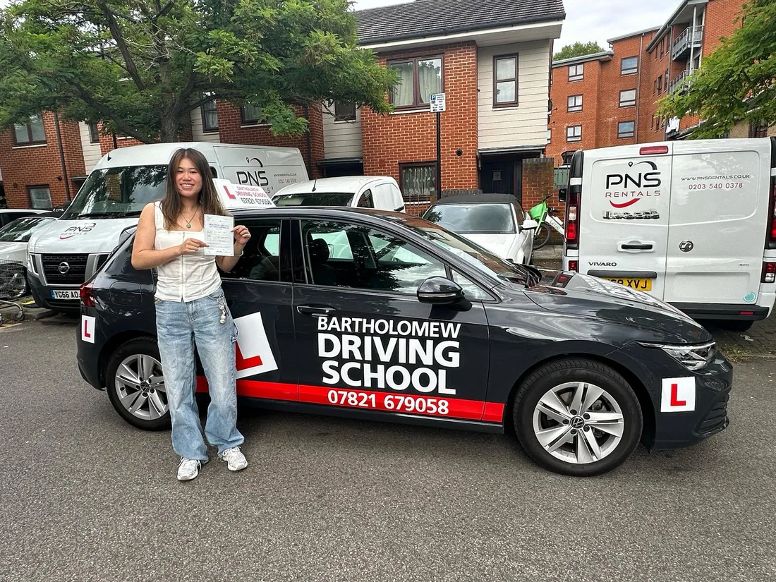 First-time pass photo with the school car