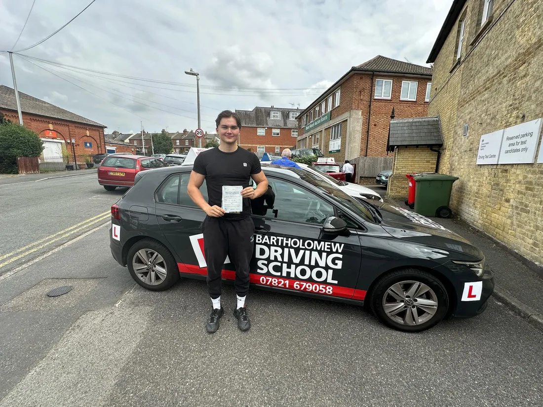 First-time pass photo with the school car