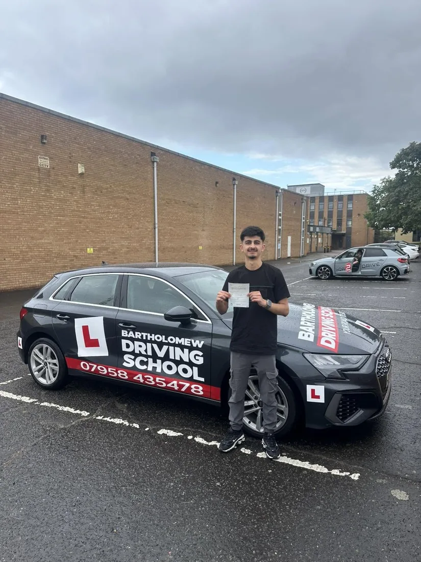 First-time pass photo with the school car