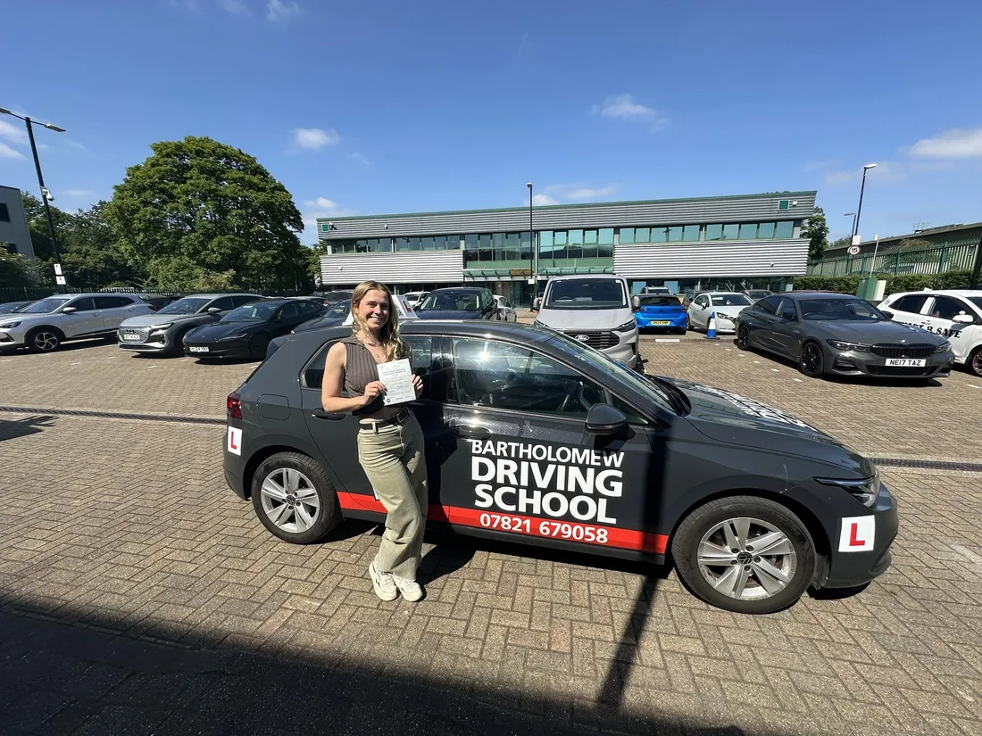 First-time pass photo with the school car