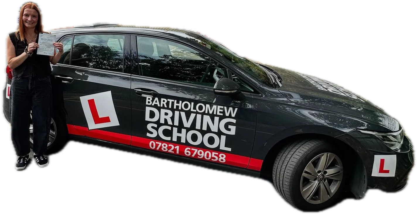 Pupil with pass certificate beside the VW Golf